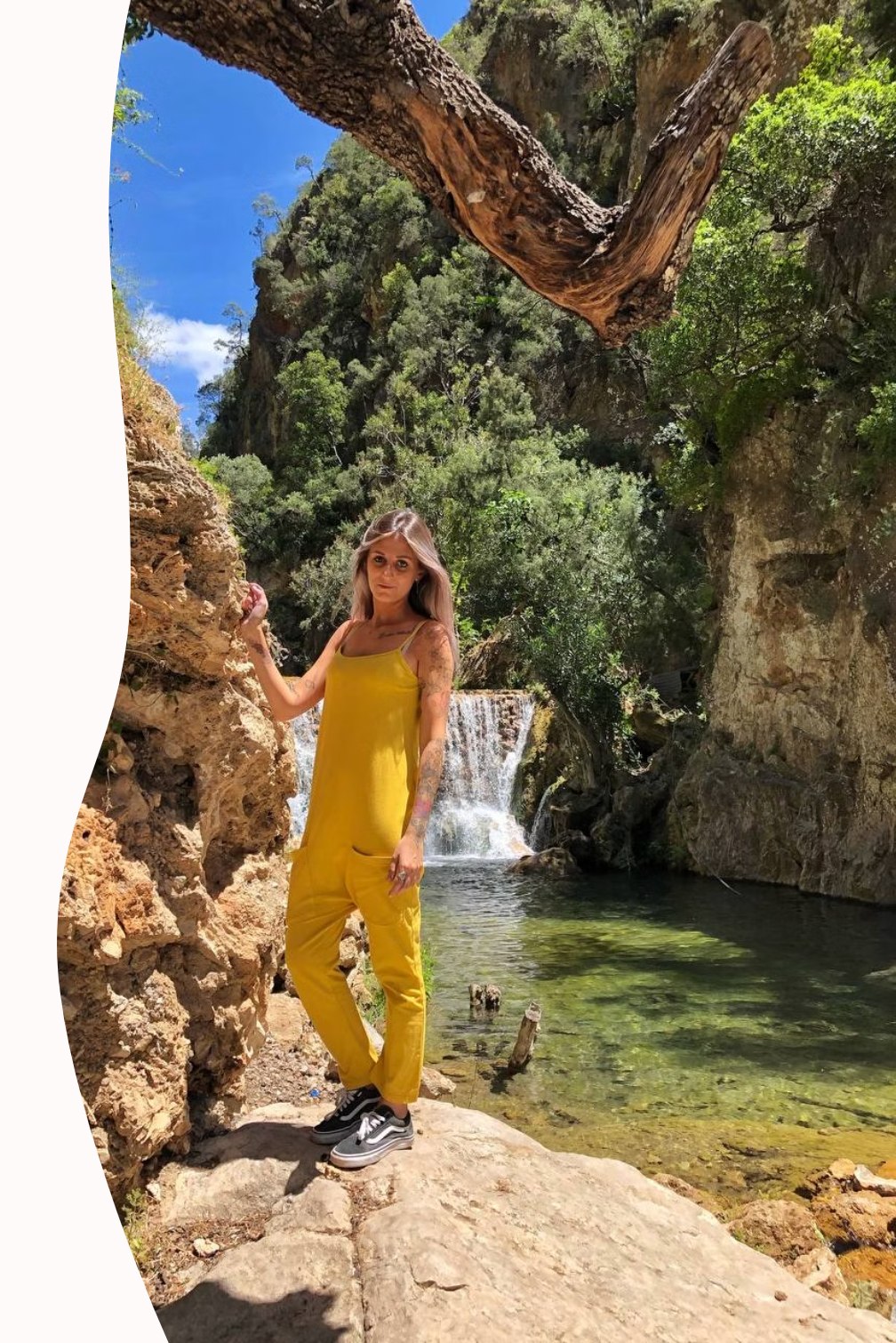 Ilaria standing by a natural pool in a canyon