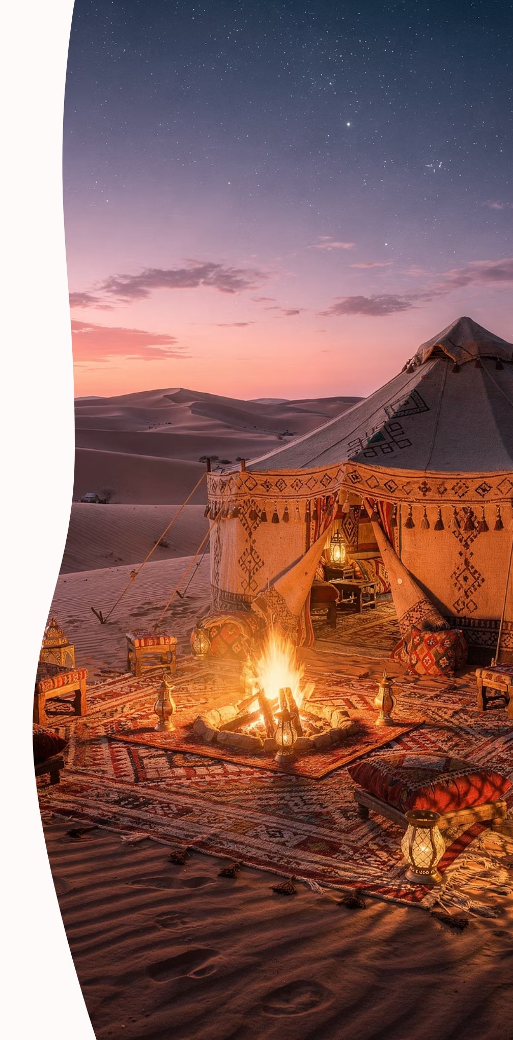 Desert camp with tent, fire and dunes at twilight