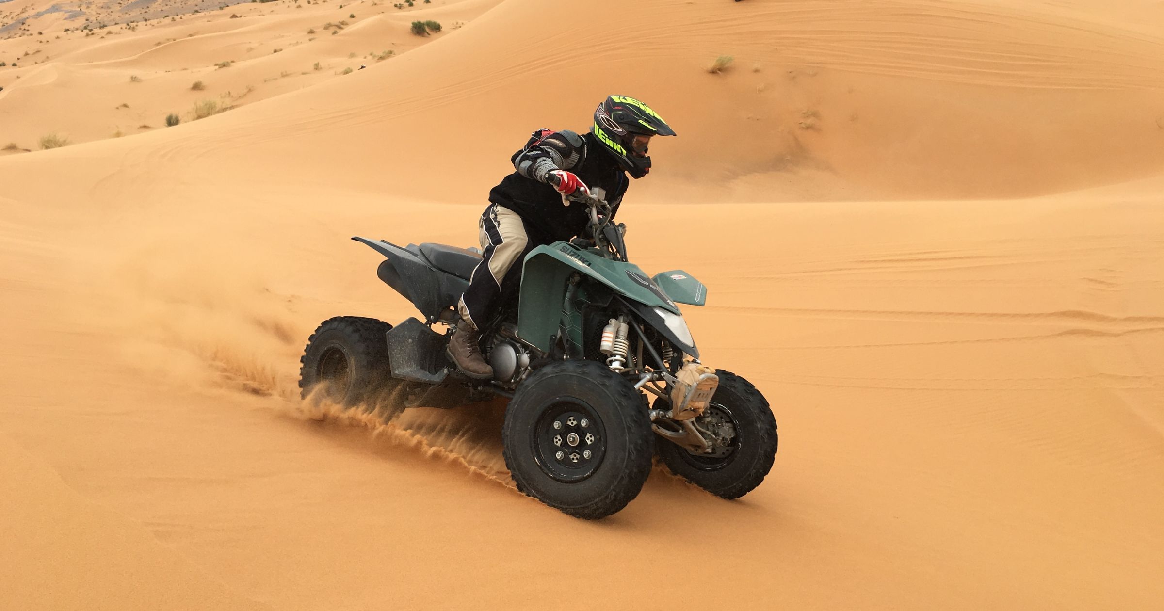 Quad bikes on Tamri desert dunes at sunset