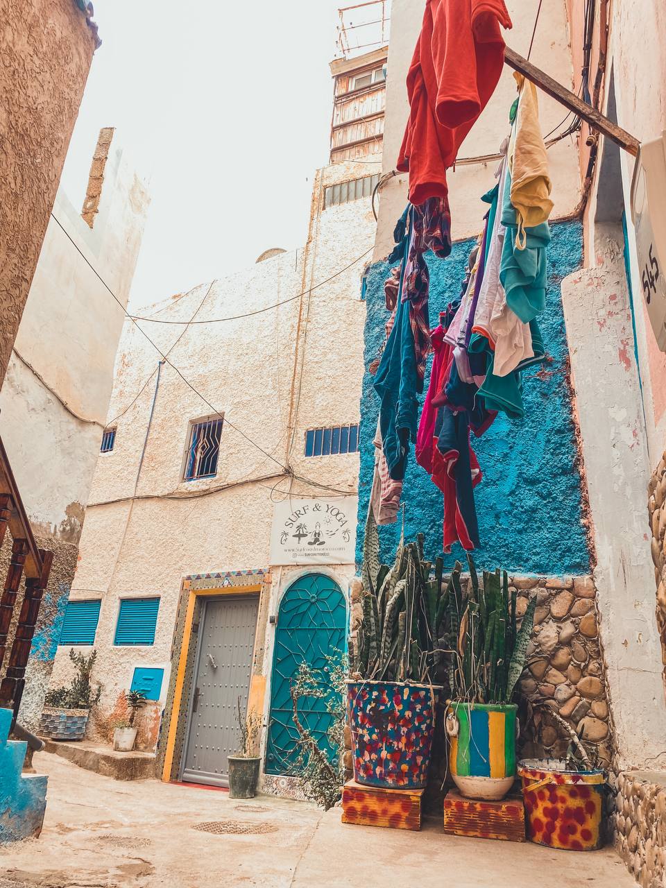 Narrow alley in Taghazout village with blue doors