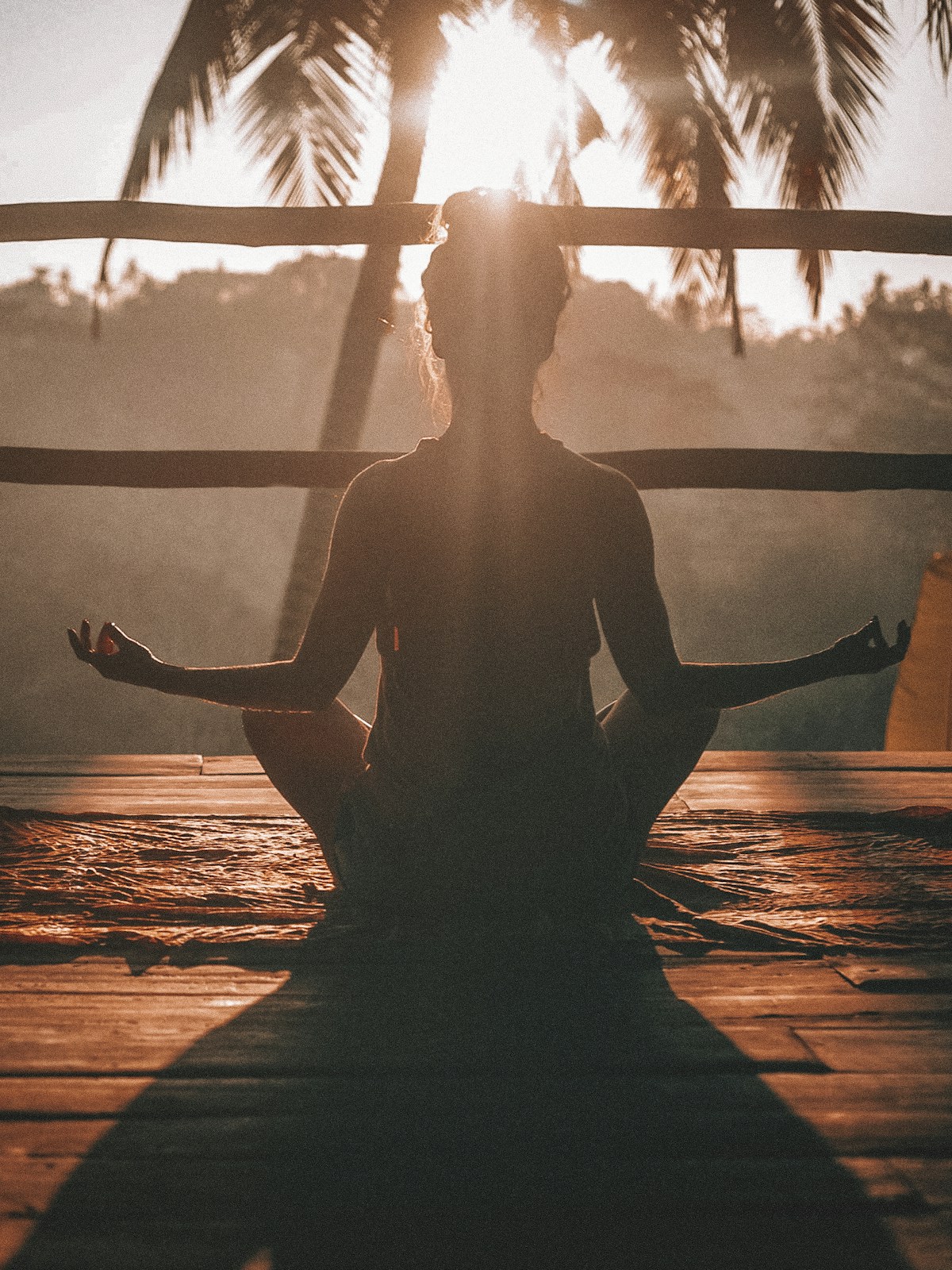 Yoga session on the beach at sunrise